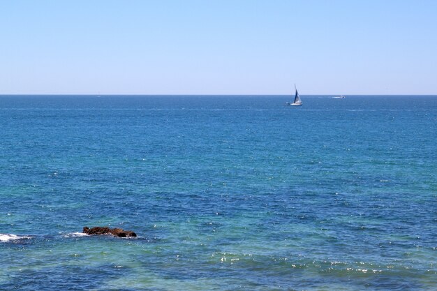 Portuguese sailing ship on a blue sea.