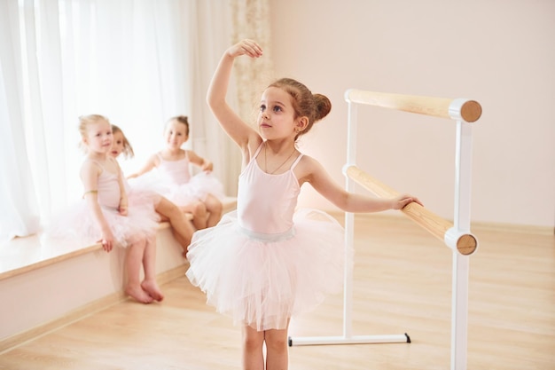 Posing for a camera Little ballerinas preparing for performance