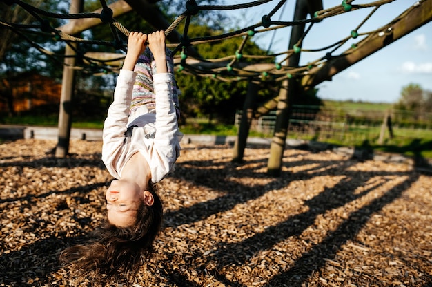 Positive cute child playing at the field happy and excited kid Candid photography