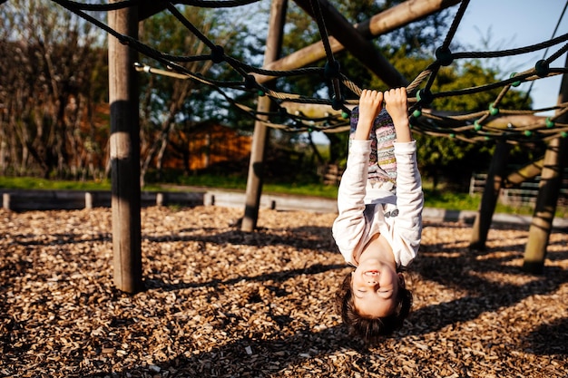 Positive cute child playing at the field happy and excited kid Candid photography