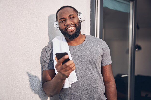 Positive delighted male person posing on camera