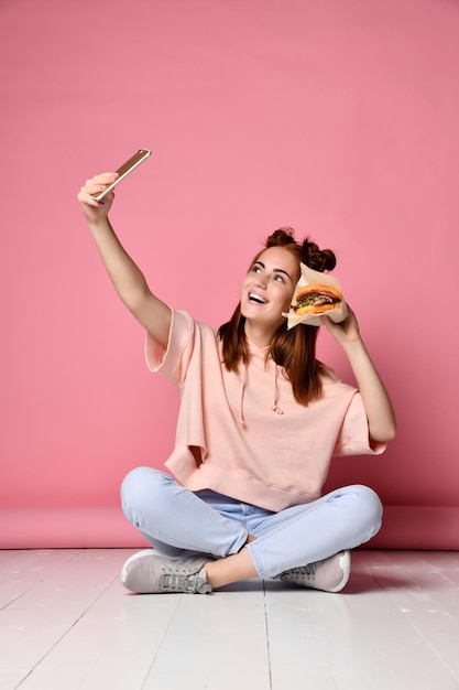 Positive ginger young woman pose for selfie