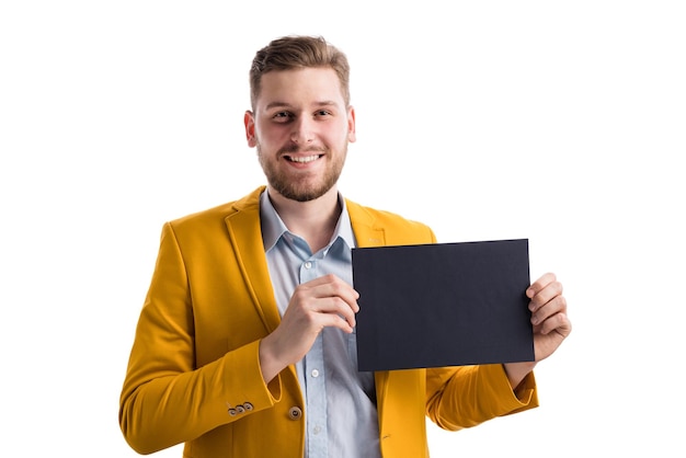 Positive handsome man holding blank black