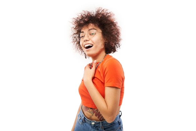 Positive lucky kazakh girl with afro hairstyle laughing rejoices celebrating victory heard good news isolated on white background