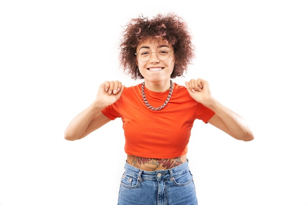 Positive lucky kazakh girl with afro hairstyle laughing rejoices celebrating victory heard good news isolated on white background