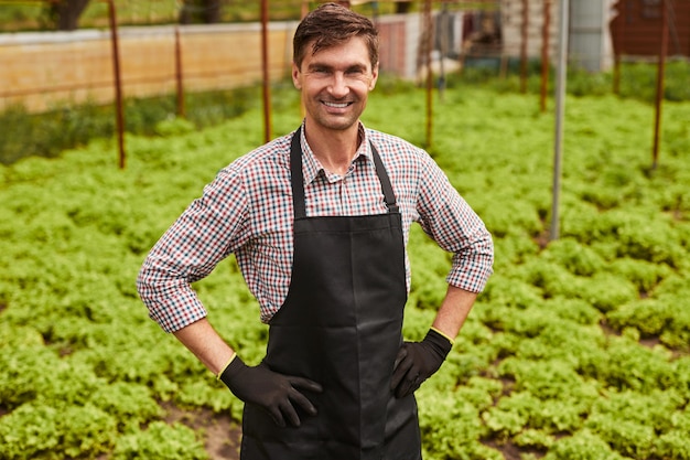 Positive male farmer during work