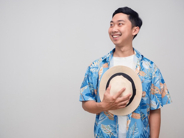 Positive man beach shirt hold hat happy smile looking isolated