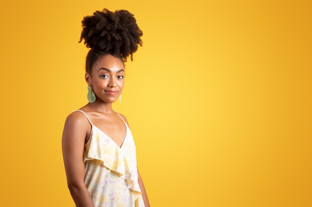 Positive pretty millennial black curly lady in dress enjoy weekend