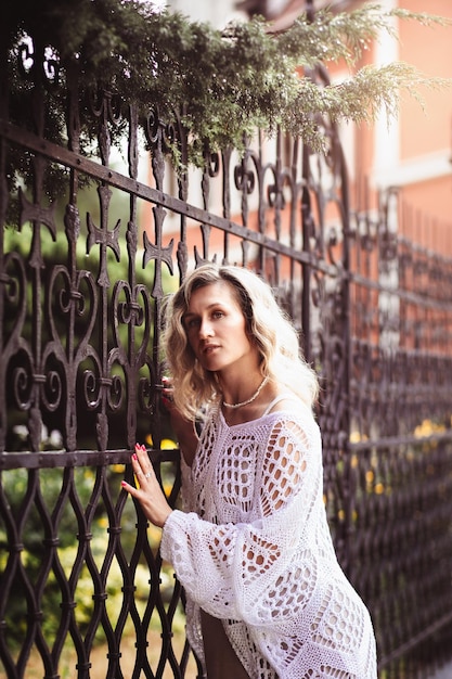 Positive romantik girl in the city center shot of amazing blonde haired lady with natural make up look happy walking outdoors