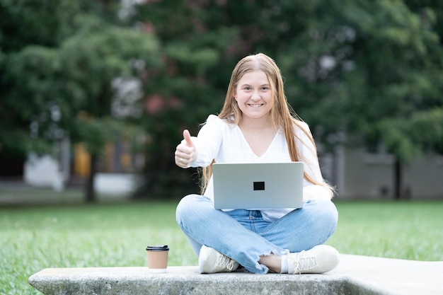 Positive young freelancer smiling at camera