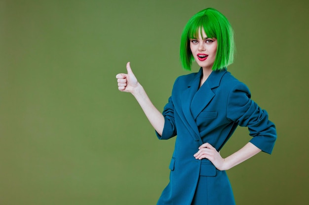 Positive young woman attractive look green wig blue jacket posing color background unaltered