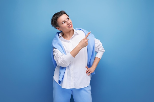 Positive young woman with short haircut in stylish casual look