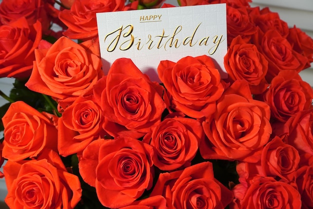 Photo postcard internet banner with a birthday greeting with the inscription happy birthday a bouquet