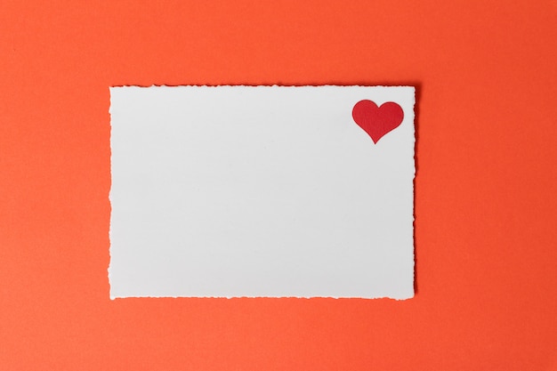 Postcard template with burgundy heart on a red background.