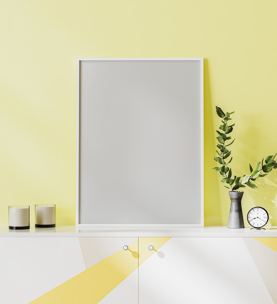 Poster frame mock up on yellow wall background, standing on white, gray and yellow chest of drawers with decorations, 3d rendering