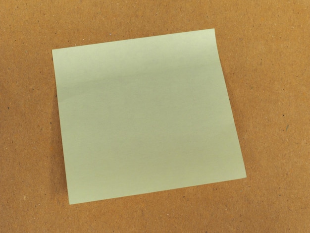 Postit over brown with copy space