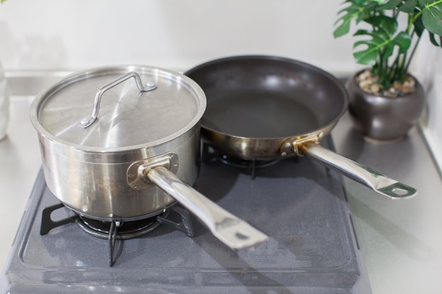 Pot and pan set on the kitchen gas stove