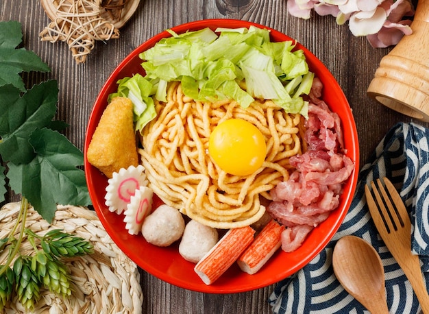 Pot roasted pasta in a bowl top view on wooden table taiwan food