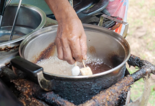 Pot with hand and vegetable oil Set on a very hot fire