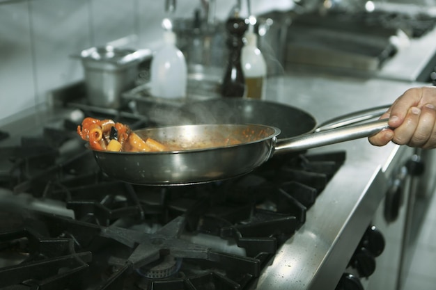 pot with pasta on the fire stove cooking