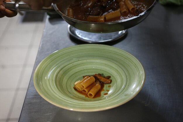 pot with pasta on the fire stove cooking