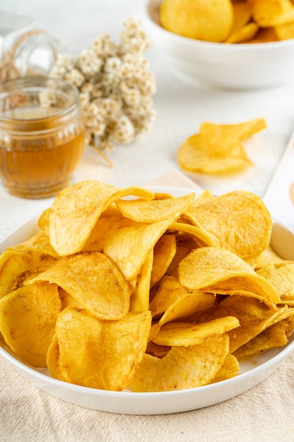 Potato chips are thin strips of potato that are deep fried or baked until crisp