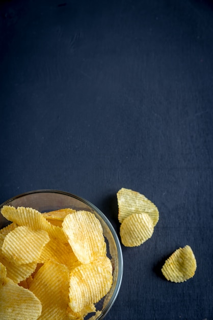 Potato chips in the glass bowl