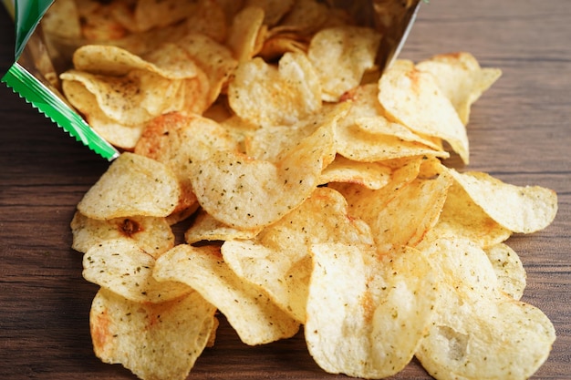 Potato chips in open bag delicious BBQ seasoning spicy for crips thin slice deep fried snack fast food in open bag