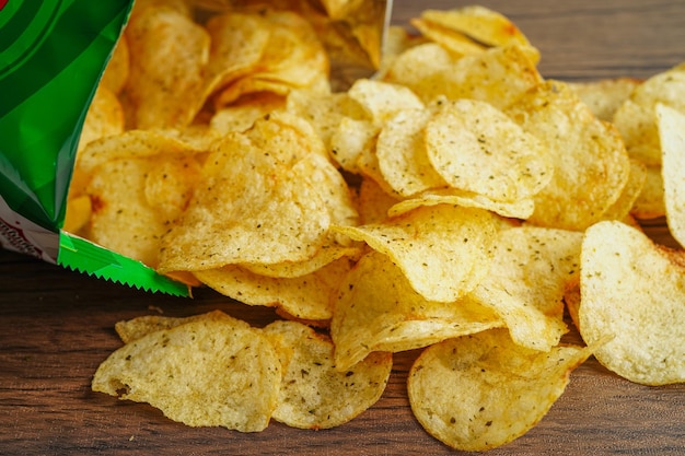 Potato chips in open bag delicious BBQ seasoning spicy for crips thin slice deep fried snack fast food in open bag