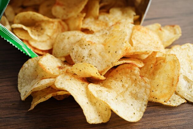 Potato chips in open bag delicious BBQ seasoning spicy for crips thin slice deep fried snack