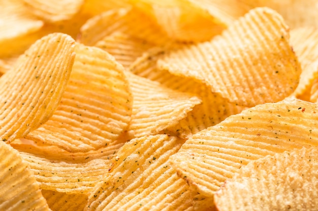 Potato chips texture background. Potatoes pattern