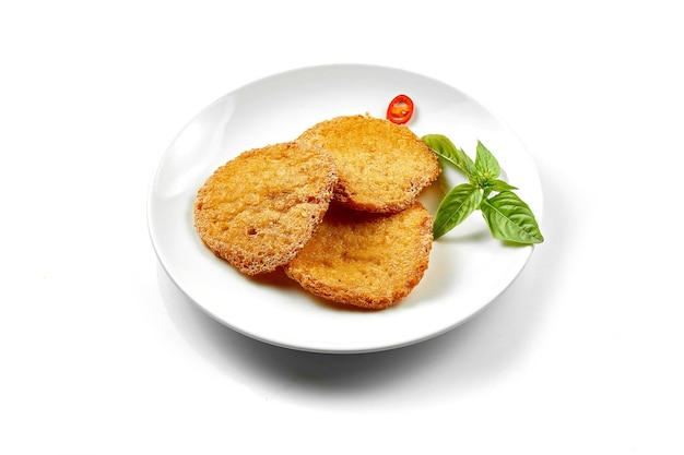 Potato draniki in a white plate on a white background Closeup selective focus