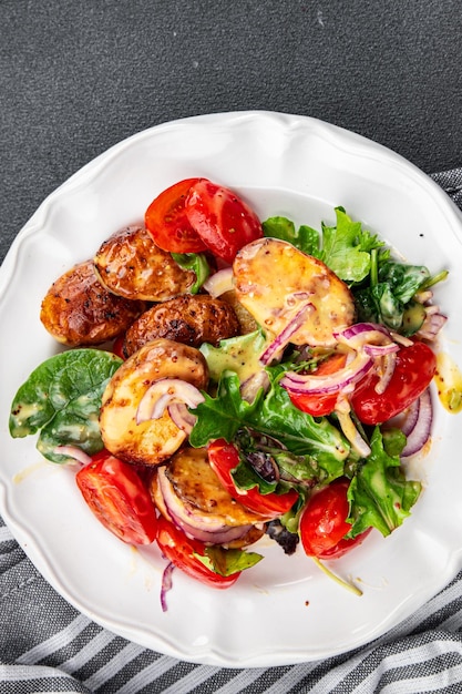 potato salad and vegetable baked potato tomato onion salad leaves salad dressing vinaigrette