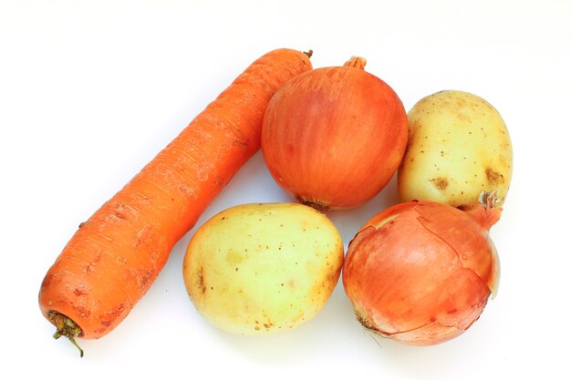 Potatoes, carrots and onions isolated are isolated