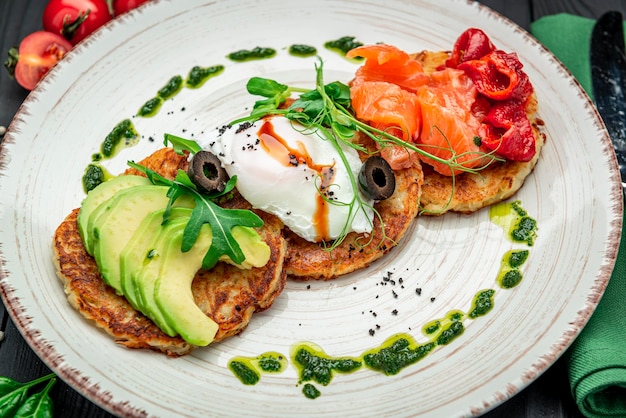 Potatoes pancakes Hash brown Hashbrown with feta cheese salted salmon and chopped avocado