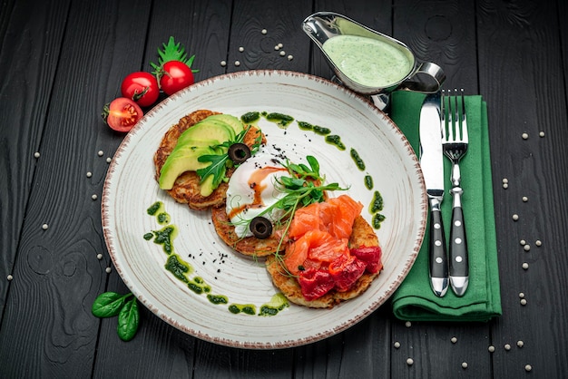 Potatoes pancakes Hash brown Hashbrown with feta cheese salted salmon and chopped avocado