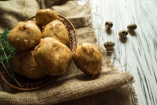 Potatoes quail eggs on a white table 2