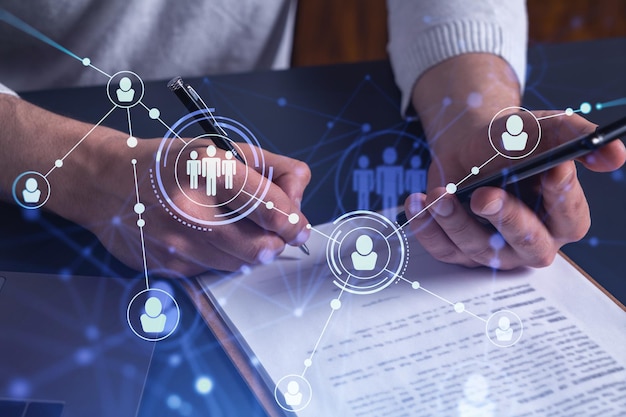 A potential employee signing the contract to boost his career and gain new opportunities in personal growth Concept of success Checking the detail of the deal at smartphone Social media icons