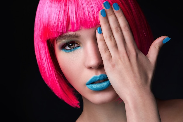 Potrait of young woman with pink hair