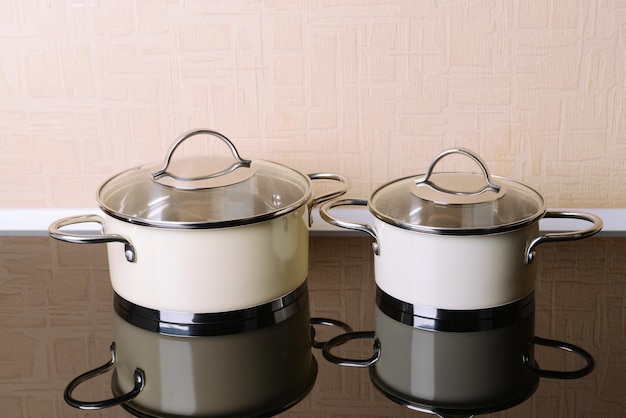 Pots on table in kitchen