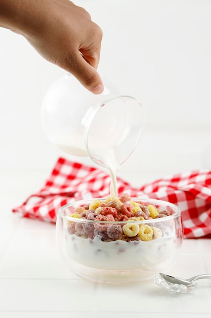 Pour Milk to the Bowl with Colorful Cereal RIng