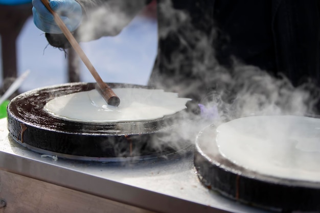 Pour the pancake batter into the skillet Prepare pancakes