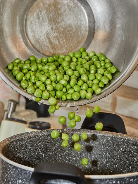 Pour the washed fresh green peas into the cooking pot