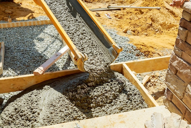 Pouring cement for pavement laid from the house to the road