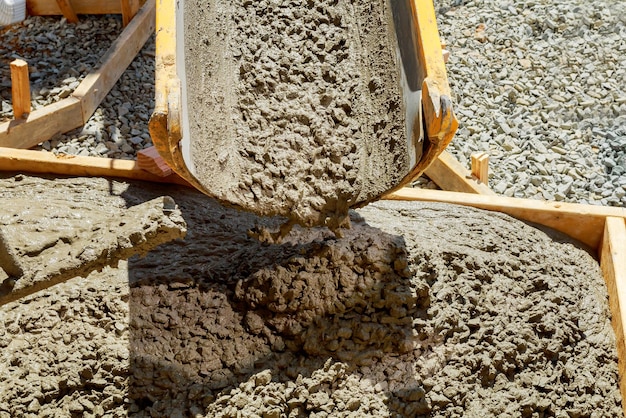 Pouring cement for pavement laid from the house to the road