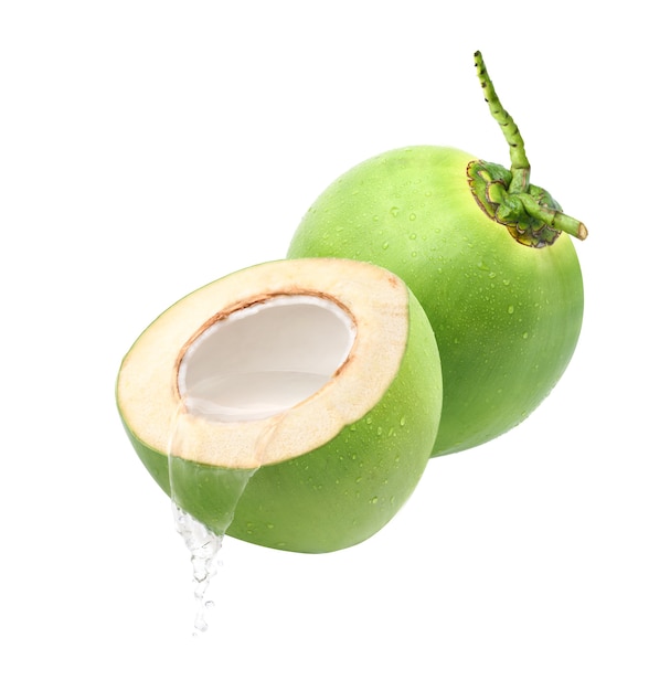 Pouring coconut juice isolated on white background.