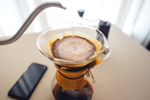 Pouring a hot water over a drip coffee