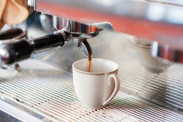 Pouring of machine making coffee