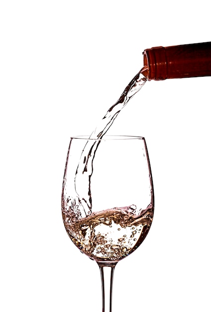 Pouring white wine into a glass