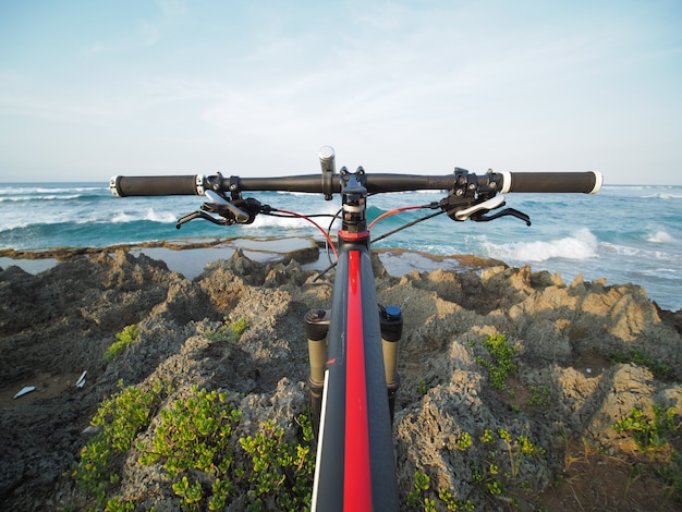 POV of mountain bike at ocean view. Tropical island.